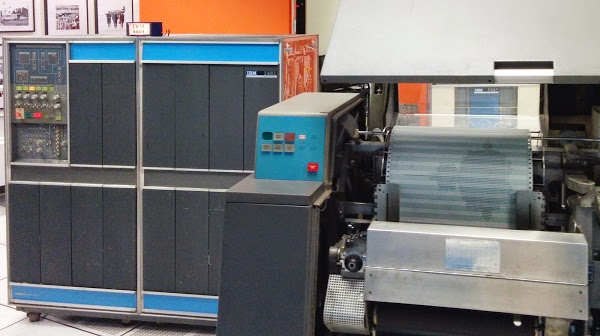 The IBM 1401 mainframe computer (left) at the Computer History Museum printing the Mandelbrot fractal on the 1403 printer (right). Note: this is a line printer, not a dot matrix printer.