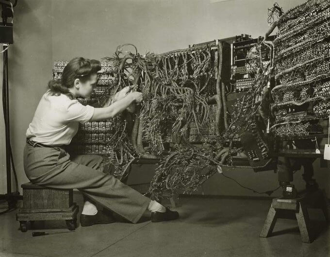 Berenice Abbott possibly in 1940s-1950s shows an engineer wiring an IBM 405 Alphabetic Accounting Machine